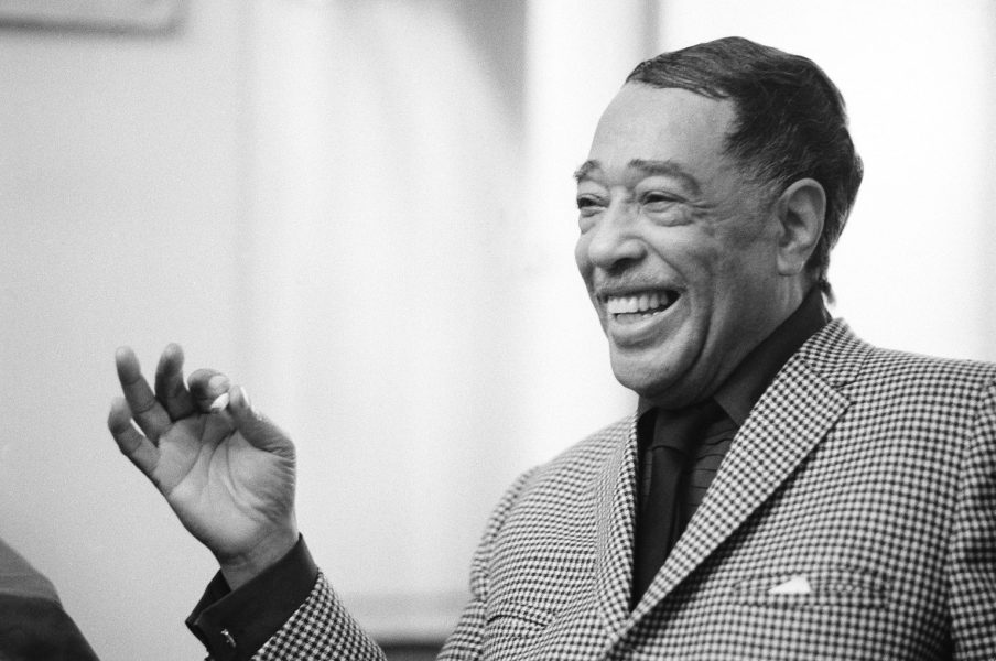 FILE - This April 24, 1969 file photo shows musician Duke Ellington in New York. "After Midnight," a joyous musical revue celebrating Duke Ellington's years at the famous Cotton Club nightclub in Harlem in the late `20s and early `30s, will begin shows downtown _ at the Brooks Atkinson Theatre on Broadway. Directed and choreographed by Warren Carlyle with musical direction by Wynton Marsalis, the show appeared off-Broadway last year at New York City Center under the name "Cotton Club Parade." (AP Photo/John Duricka, file)