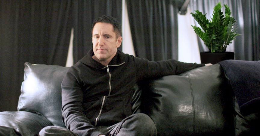 Trent Reznor sits on a couch before taking the stage at the Key Arena on Friday, November 22, 2013 in Seattle, Wash. (Photo by Matthew Ryan Williams for WIRED.com)