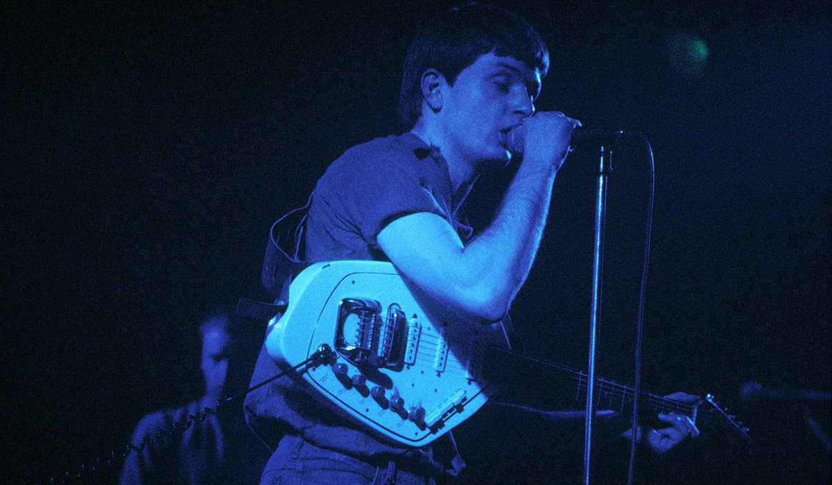 UNITED KINGDOM - FEBRUARY 29: LYCEUM Photo of Ian CURTIS and JOY DIVISION, Ian Curtis performing live onstage, playing Vox Phantom Special VI guitar (Photo by Chris Mills/Redferns)